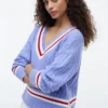 Cricket-sweater i kabelstrik Cricket-sweater i kabelstrik